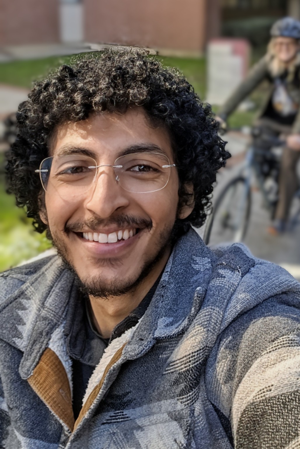 Atef Adel Sheekhoon smiling outdoors